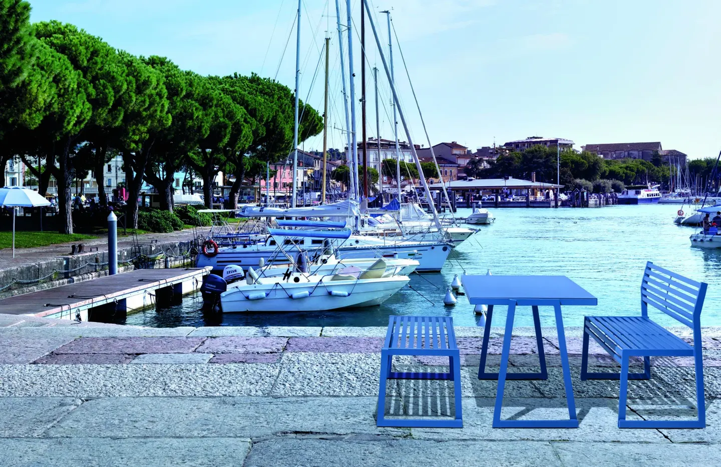 Blue Cortina.026 tables and seating overlooking a marina