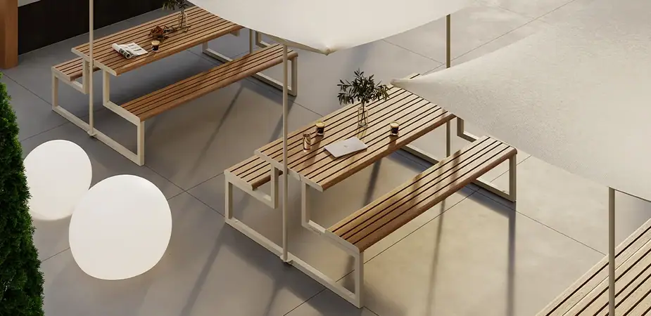 Ventiquattrore.h24 wood-effect picnic tables and benches under sail shades on a rooftop terrace