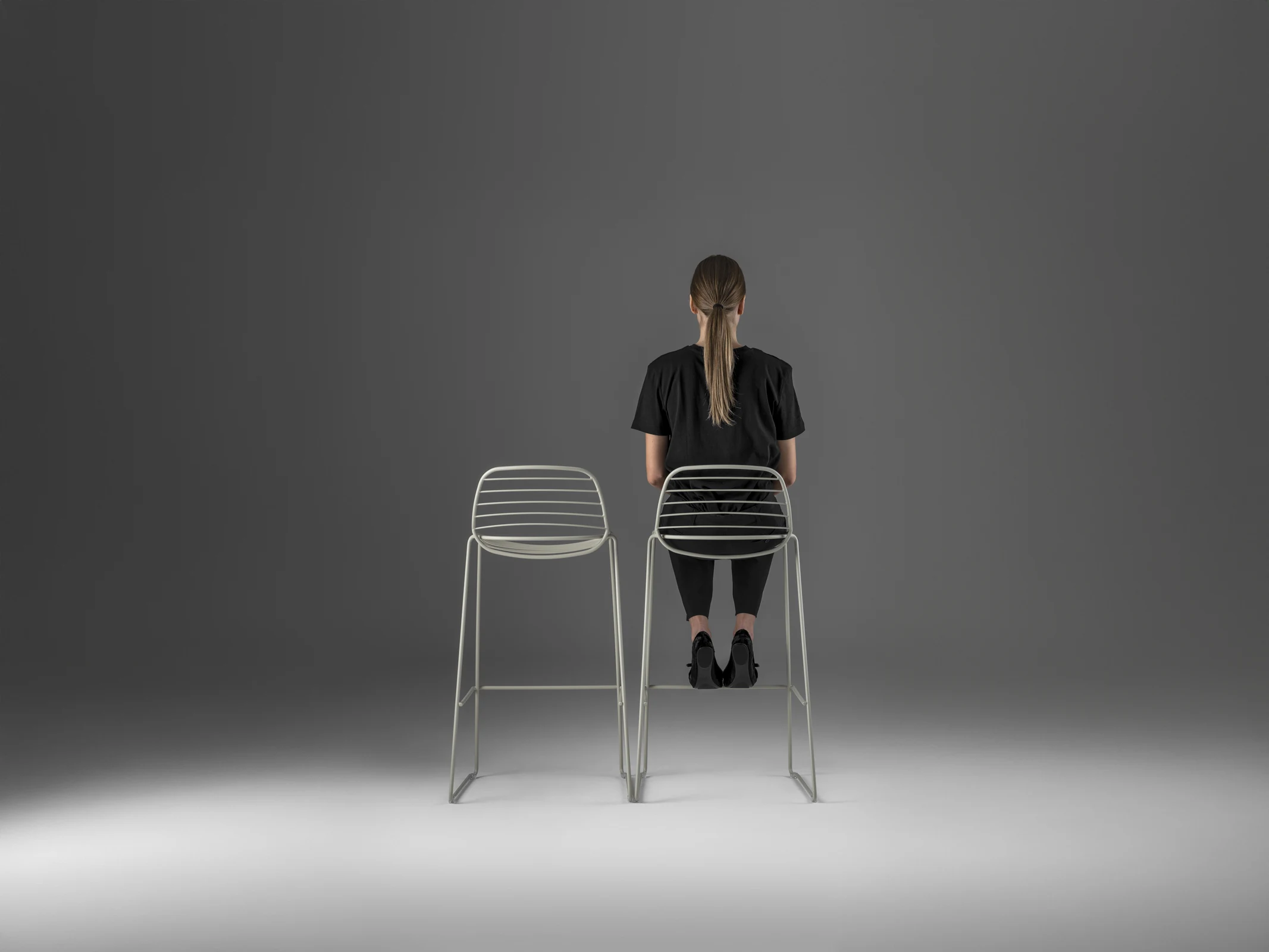 Eclipse Wire chairs on a landscaped outdoor terrace